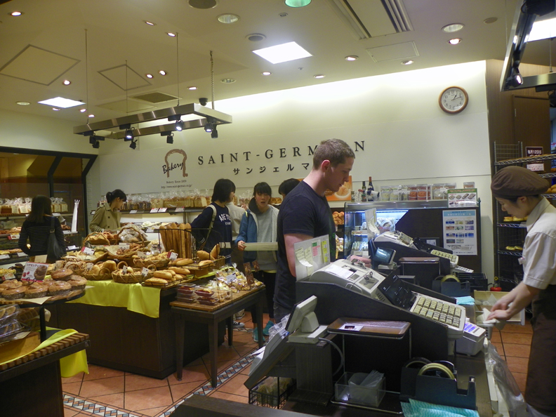 Josh, making a purchase at one of the bakery shops in the mall.